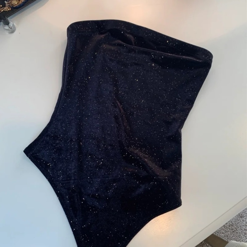gold and black bodysuit